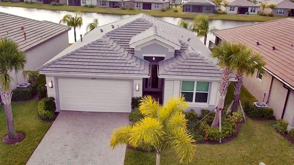 Photo of 12175 SW Jasper Lake Way, Port Saint Lucie, FL 34987 (MLS # R10758053)