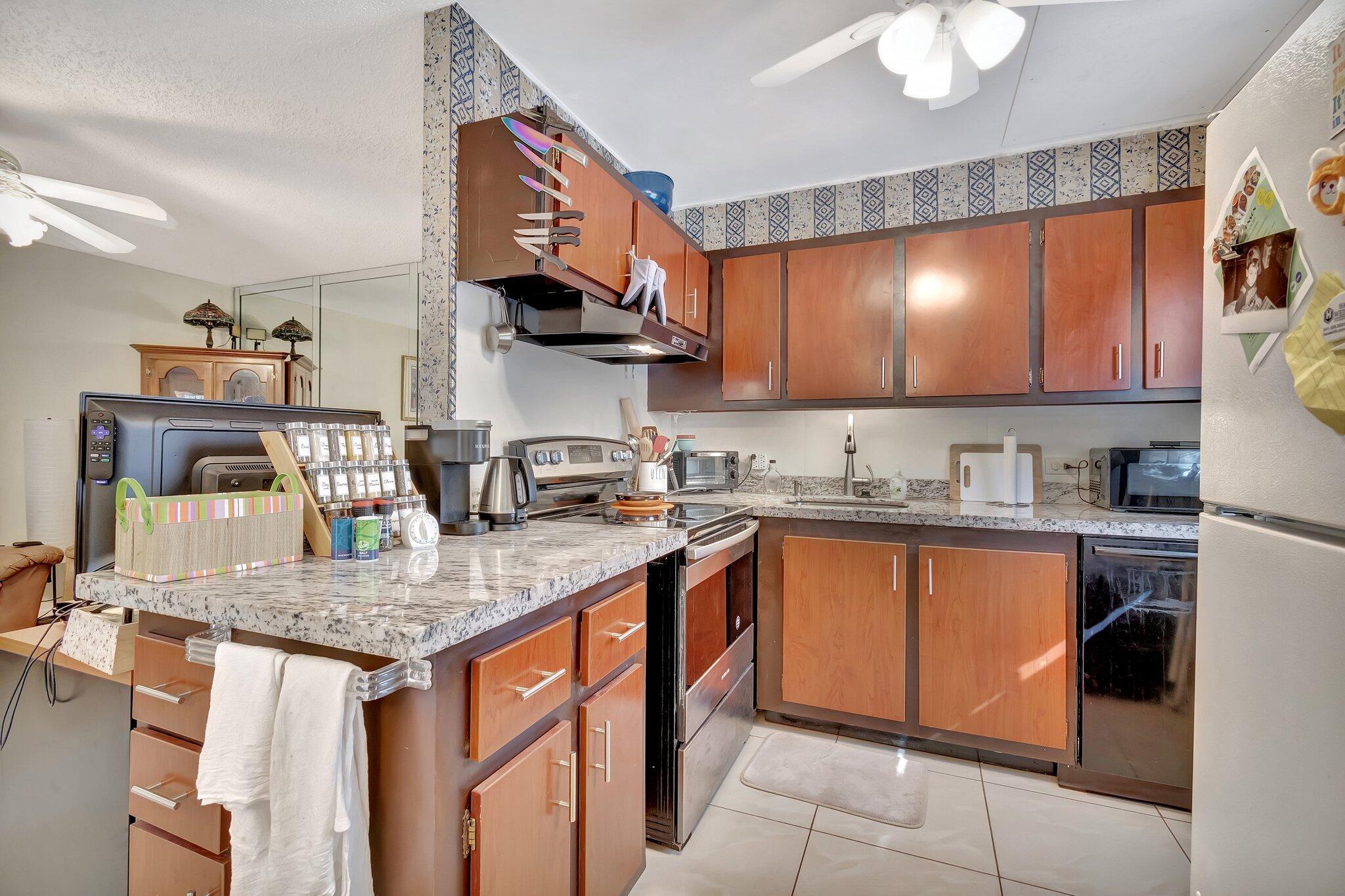 CENTURY VILLAGE, ACTIVE ADULKT COMMUNITY--55+ COMMUNITY.Welcome to unparalleled living in the heart of Florida's pristine Boca Raton. Located within the esteemed Century Village, this charming third-floor corner condo offers a delightful mix of comfort, quality, and tranquility that matches the vibe of this vibrant, Active Adult Neighborhood. At 116 Mansfield C, emphasis is placed on inviting spaces and bright living. Enter into a welcoming and generously proportioned living room that offers ample room for relaxation and entertainment. Follow the free-flowing semi-open concept floor plan to the dining area that allows a smooth transition from kitchen to table.