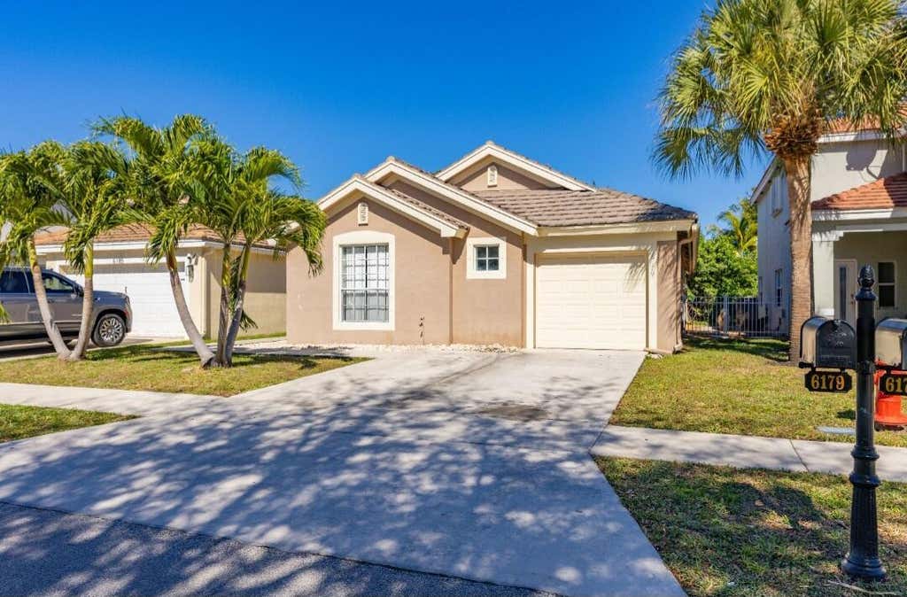 Photo of 6179 SAVANNAH Way, Lake Worth, FL 33463 (MLS # B26069029)