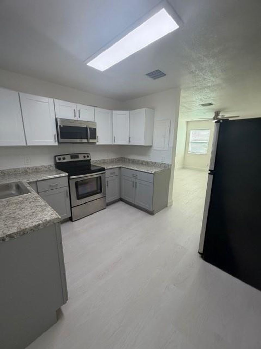 Photo of 1310 W 28th Street, Riviera Beach, FL 33404 (MLS # F10548496)