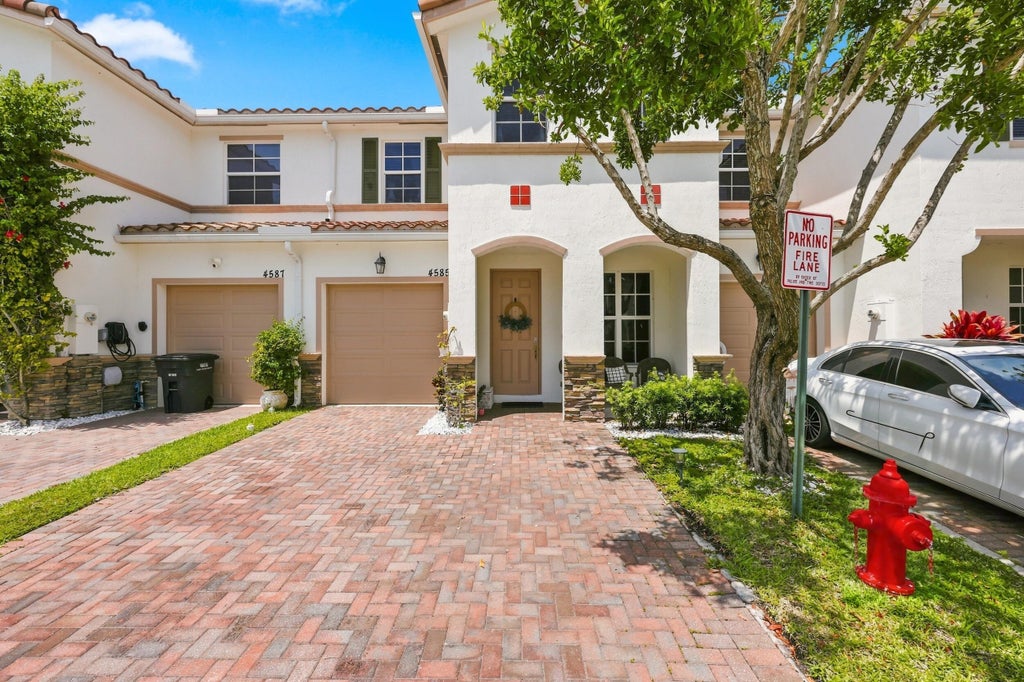 Photo of 4585 Tara Cove Way, West Palm Beach, FL 33417 (MLS # B26066740)