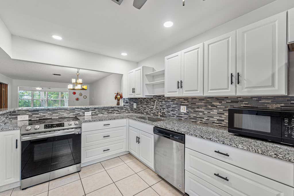Photo of 2638 Gately Drive E #125, West Palm Beach, FL 33415 (MLS # B26042325)