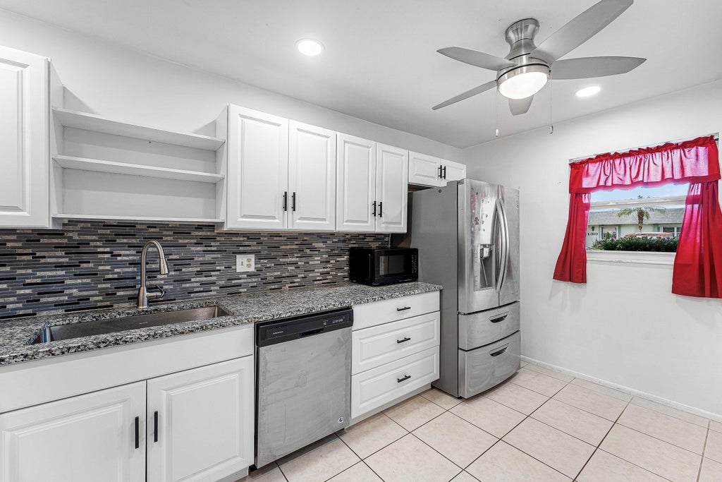 Photo of 2638 Gately Drive E #125, West Palm Beach, FL 33415 (MLS # B26042325)