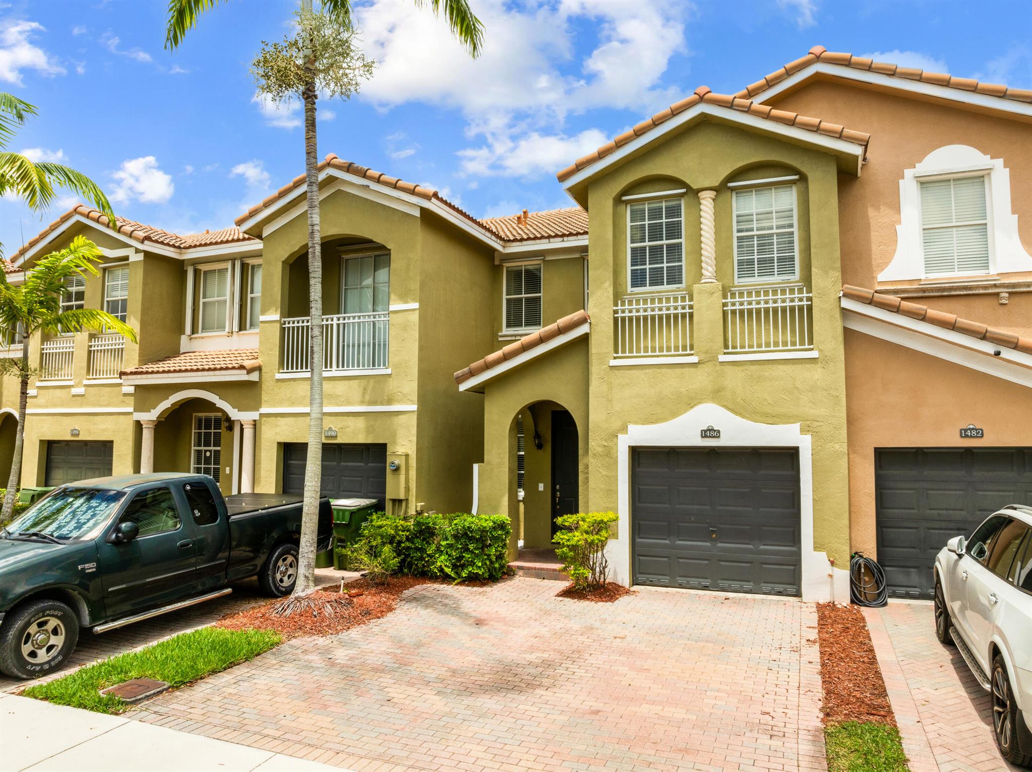 Lovely 3BD/2.5BA townhome in gated Homestead community of Keys Garden/Palm Breeze! Features aprox 20-ft ceilings, patio, attached garage, walk-in closets, storage under stairs, and A/C (2024). Community amenities include pool, gym, BBQ area, playground and clubhouse. Washer/Dryer is on the second floor! Pet friendly. Allows rentals. Approximately 35 miles from Key Largo, perfect for weekend getaways! Explore nearby favorites like Everglades National Park, Coral Castle, and Homestead Bayfront Park.  Close to dining, schools and hospital. Being sold AS-IS. Don't miss this opportunity to enjoy space, sunshine, and Florida charm!
