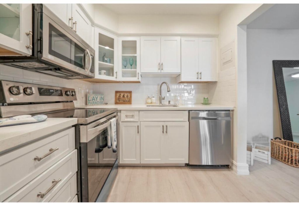 Photo of 170 Cypress Club Drive #702, Pompano Beach, FL 33060 (MLS # B26091945)