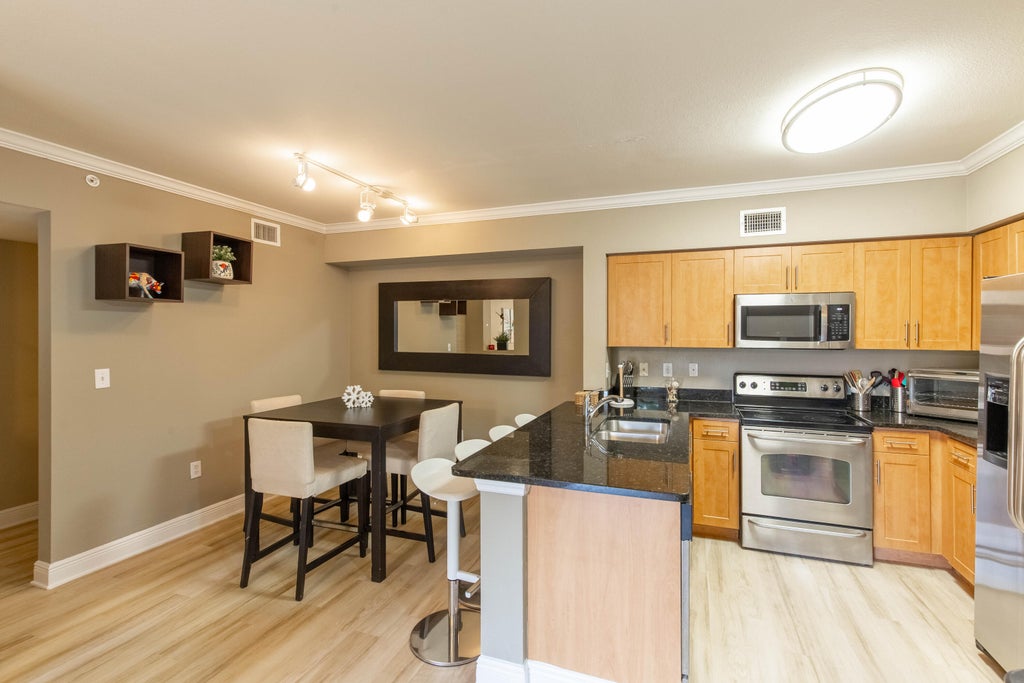 Photo of 6559 Emerald Dunes Drive #201, West Palm Beach, FL 33411 (MLS # R11107284)