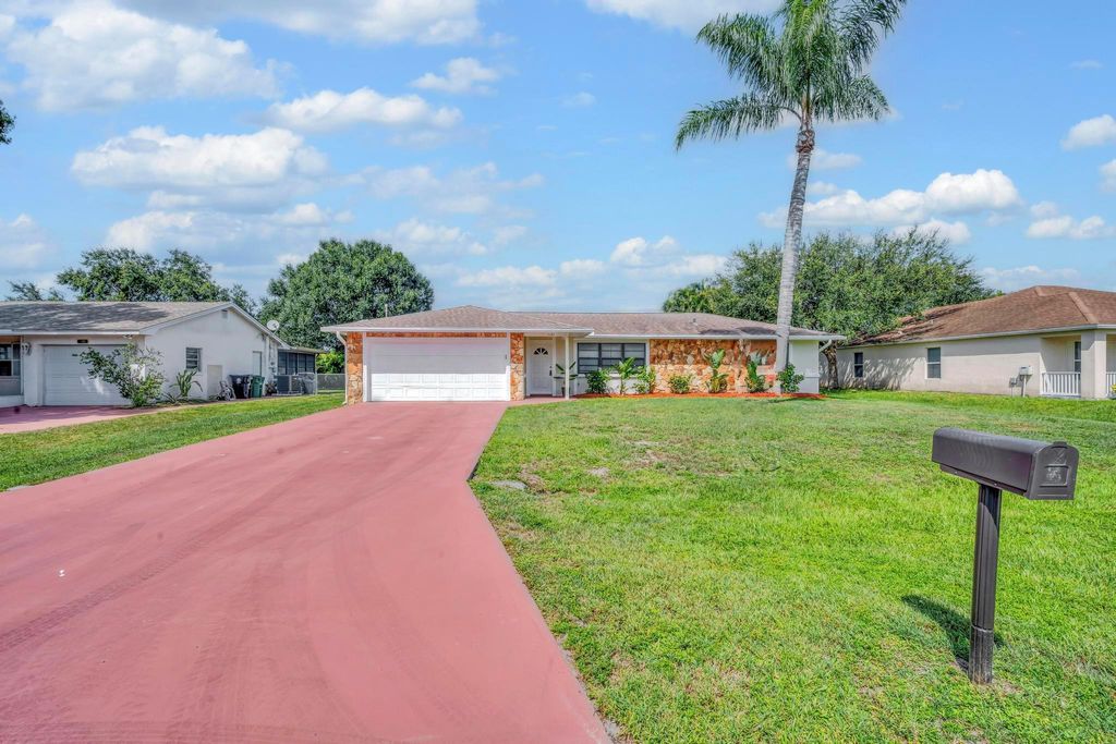 Photo of 1131 SE Puritan Lane, Port Saint Lucie, FL 34983 (MLS # R11108374)