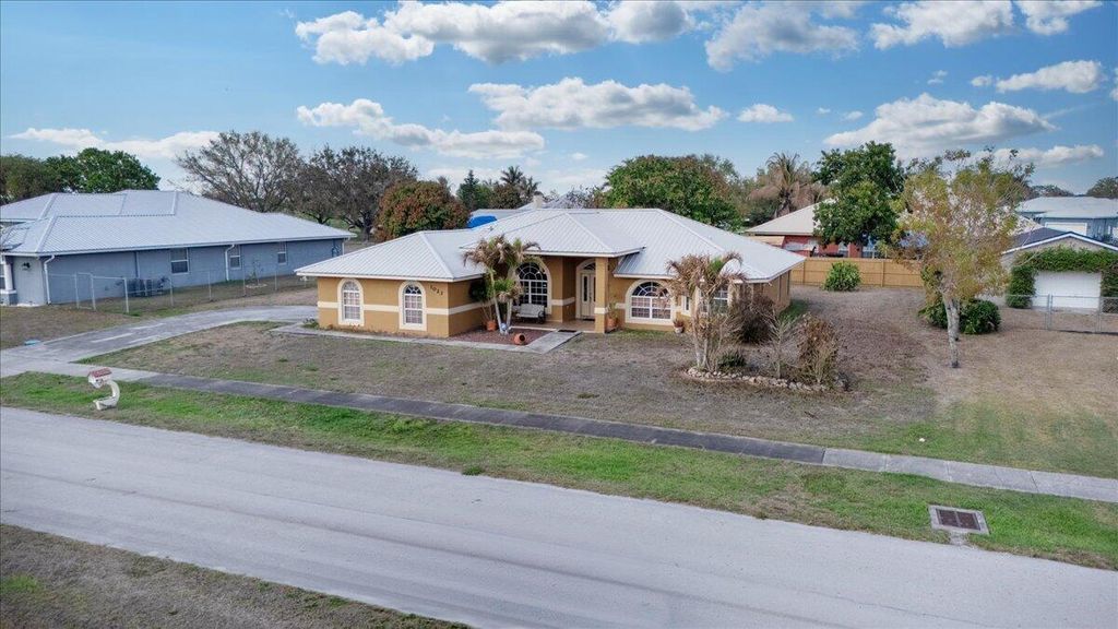Photo of 1023 Caribbean Avenue, Clewiston, FL 33440 (MLS # B26000670)