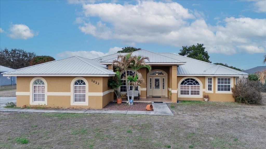 Photo of 1023 Caribbean Avenue, Clewiston, FL 33440 (MLS # B26000670)
