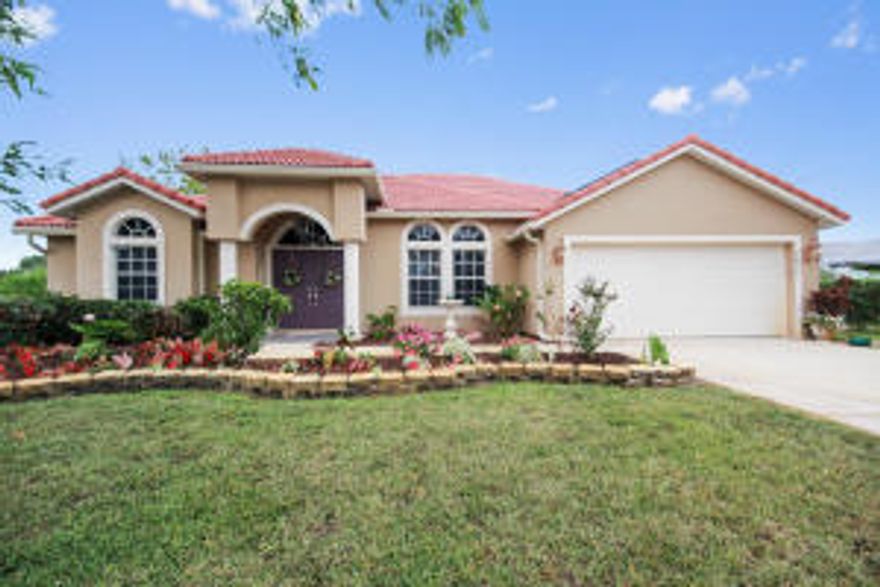 Gorgeous family home on canal lot with an extra adjacent lot cleared and ready for a second home or your RV and boat storage. Spacious open floor plan great for entertaining. Many upgrades including granite counters, lots of tile, wood laminate flooring, and upgraded lighting fixtures. Kitchen also boasts an extra pantry and pass through to a beautiful screened in lanai. Relax in a large master bedroom and bath with double sinks, roman tub, and separate water closet. Plenty of upgraded built in storage cabinets in the garage. Very large tool shed included. To see this home is to ''Love it''!