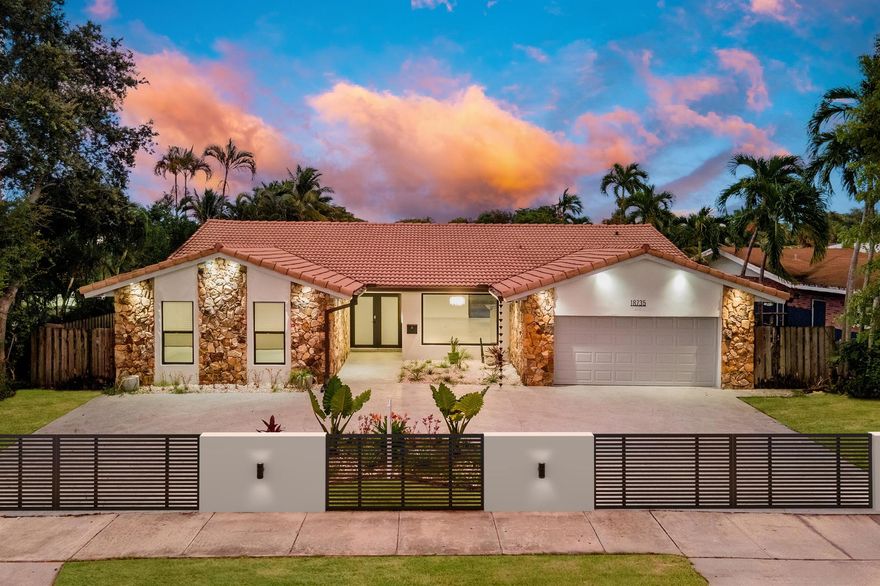 One-story lakefront masterpiece in Greyknoll Estates, a highly esteemed waterfront community. Fully renovated in 2025, this 4 bedroom, 3 bath residence blends modern elegance with chic and casual design.Designed with the entertainer in mind, the chef's kitchen is the showpiece, featuring dual 100-inch islands, dual sinks, two Bosch dishwashers, dual ovens, a super-efficient induction cooktop, and a 72-inch Monogram refrigerator/freezer with deluxe Shabbos mode. The open dining area accommodates gatherings of 36 or more, creating a natural flow between the living spaces and the outdoors.