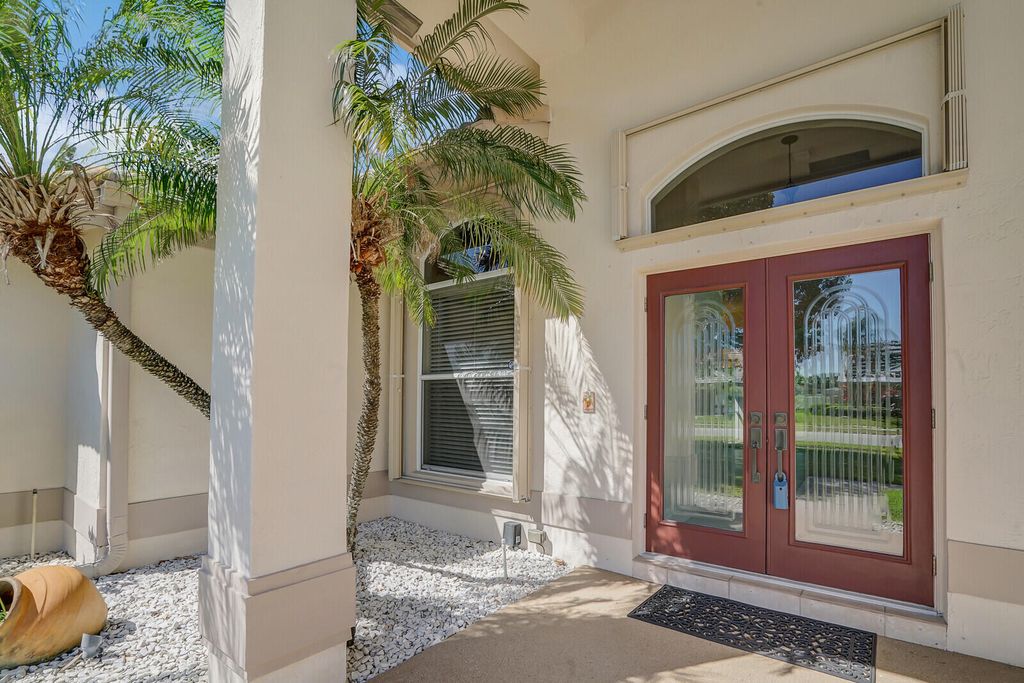 Photo of 5646 Lake Shore Village Circle, Lake Worth, FL 33463 (MLS # R11070430)