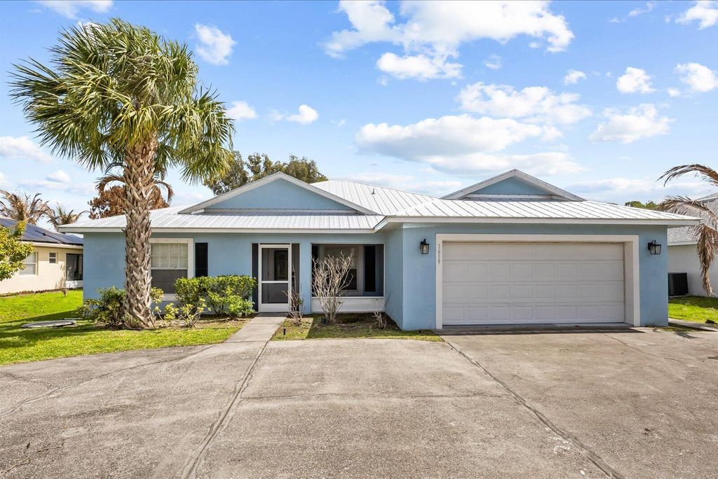 Photo of 1619 SW California Boulevard, Port Saint Lucie, FL 34953 (MLS # B26016668)