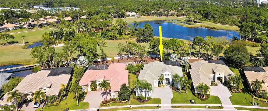 CUSTOM BUILT POOL HOME WITH GOLF & WATER VIEWS in the prestigious Scarborough Estates neighborhood of PGA Village! This elegant 4BR+Office+Flex/4.5BA/3CG home offers plenty of living space for everyone to enjoy. Some of the many special features include IMPACT GLASS windows & doors, GENERATOR, NEWER ACs (2021), new WH (2025), office with built in shelving unit, spacious lanai with pool and summer kitchen, elegant kitchen with butler's pantry and master bedroom suite with dual water closets. The minute you step through the front door the stunning vistas will catch your eye through the floor to ceiling windows. The spacious kitchen features a gas cooktop, granite counters, tumbled marble backsplash, new refrigerator & dishwasher (2024), newer double ovens & food warmer and breakfast bar.