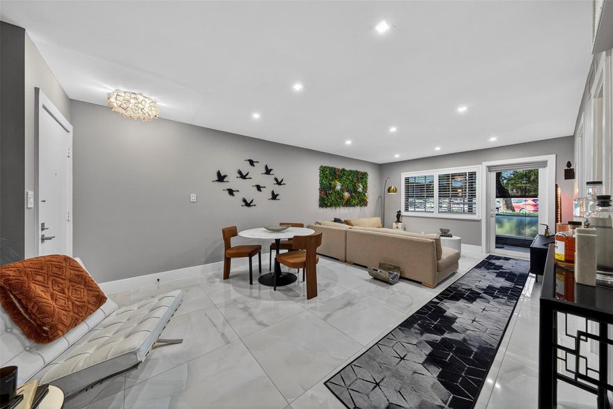 Step into modern comfort with this beautifully renovated ground-floor 1BR/1.5BA in Manor Grove Village IV. Just a short stroll to vibrant Wilton Drive, this unit features impact windows/doors, plantation shutters, polished porcelain tile, recessed lighting, and interior pocket doors. Enjoy a private screened porch plus laundry facilities across the hall, with the option to install your own washer/dryer. Community amenities include updated clubhouse, heated pool, tennis AND pickleball courts! Well-managed HOA at $530.41/mo with reserves and all assessments current. Offered furnished and move-in ready—start enjoying the South Florida lifestyle today!