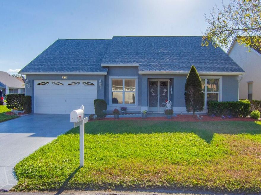 Beautifully maintained 2-bedroom, 2-bath home with a 2-car garage, located on a desirable corner lot in Kings Isle, a 55+ Community. This move-in-ready home features numerous major upgrades, including a 2024 roof, 2023 W/H, 2023 A/C, 2025 electrical panel, and updated plumbing in 2025. The interior and exterior have also been freshly painted.
Welcoming double-door entry leads to a well-designed layout with two spacious bedrooms. The primary suite includes a tub and separate shower. Additional highlights include hurricane panels, extra street parking and a shed providing ample additional storage. Hassle free HOA includes Lawn Care, internet, cable, and manned guard gate. Welcoming Resort style Clubhouse with recreational facilities and over 30 interesting clubs and many events