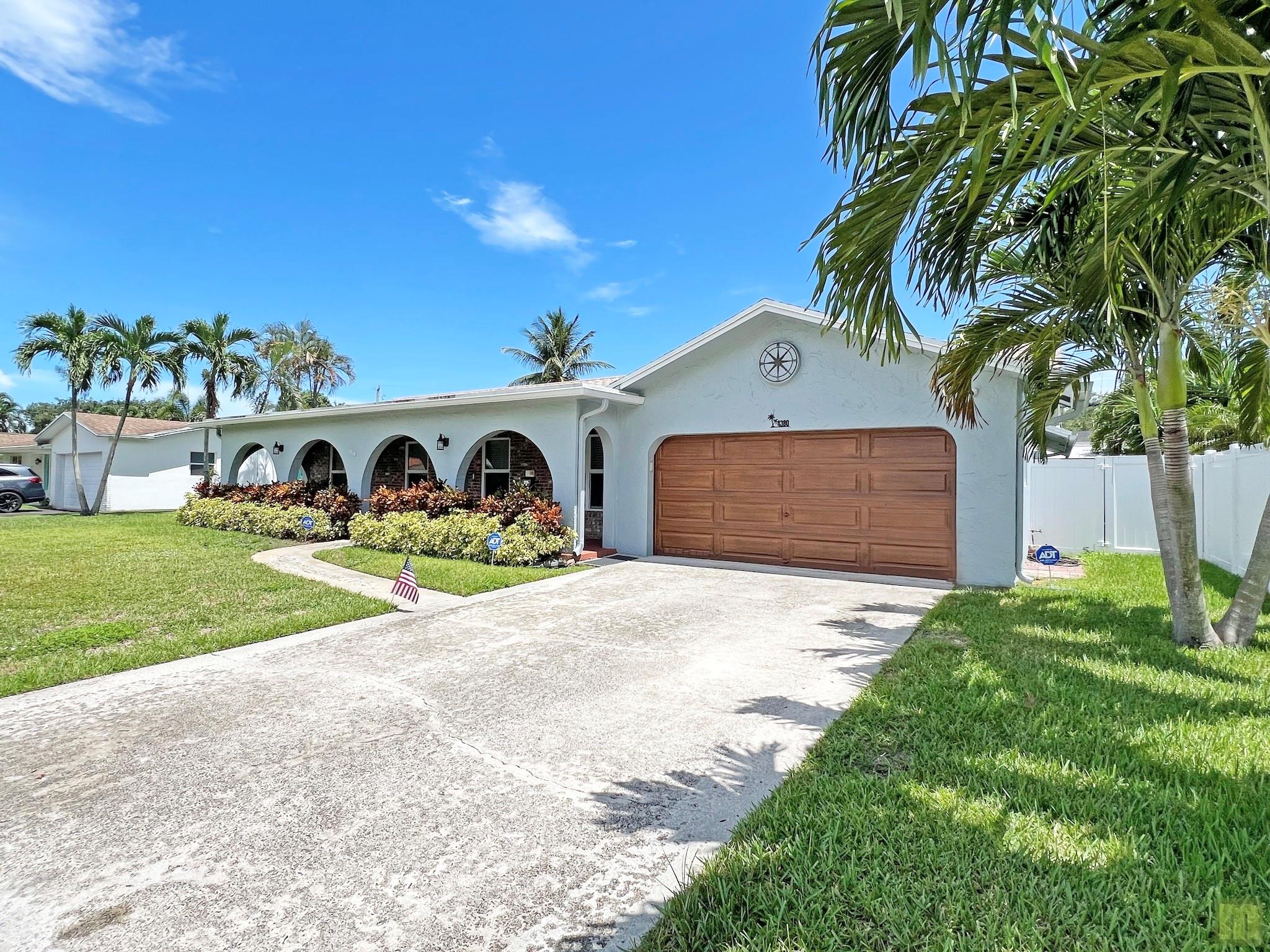 AVAILABLE NOW -- Gorgeous totally remodeled 3 bedroom, 2 bathroom home in South Coconut Creek. Amazing high-end open concept kitchen with quartz countertops & stainless steel appliances. Beautiful porcelain tile flooring in the mail living spaces and warm wood flooring in the bedrooms, Split plan, generous primary suite with private bathroom & TWO walk-in closets, 2 more roomy bedrooms with walk-ins plus a bonus family room area, additional family bathroom, 2- car garage, impact windows and doors. Close to schools, shopping, parks. Large, fully-fenced yard, covered back patio and PET FRIENDLY! Close to the Florida Turnpike and just 7 miles to the beach. Wonderful, quiet neighborhood -- your new home is waiting!! Rapid approval - NO HOA. See the virtual tour link for more views.