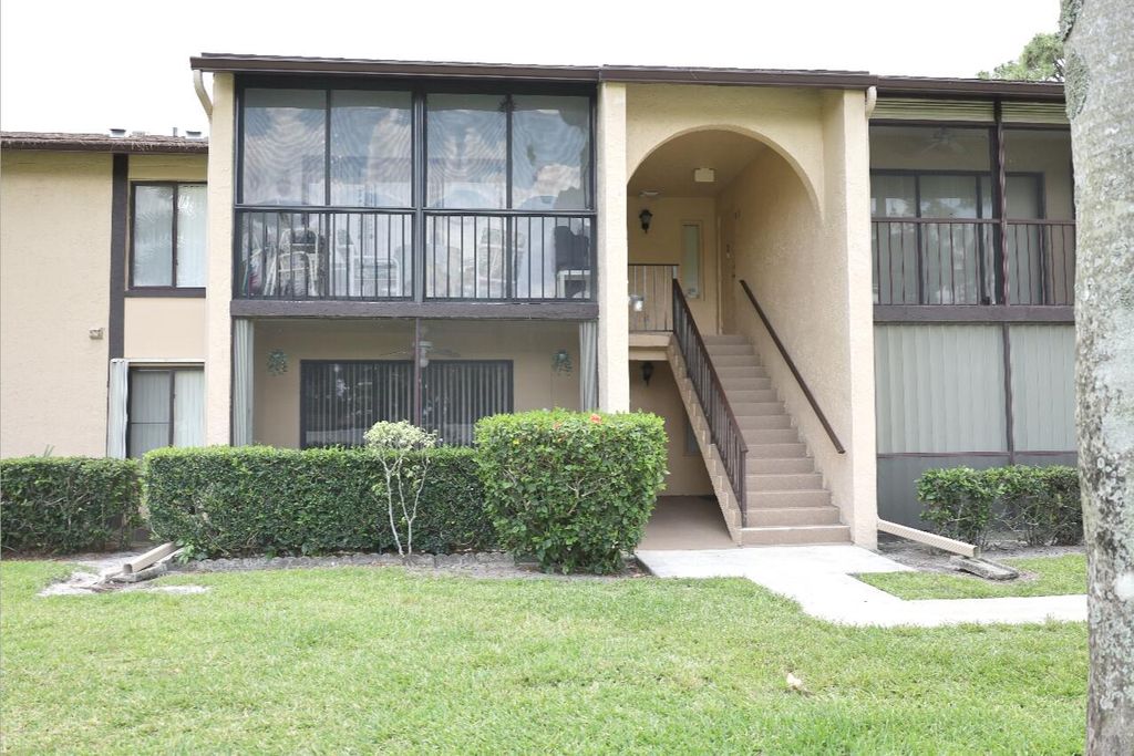 Photo of 801 Sky Pine Way #F2, Greenacres, FL 33415 (MLS # B26023523)