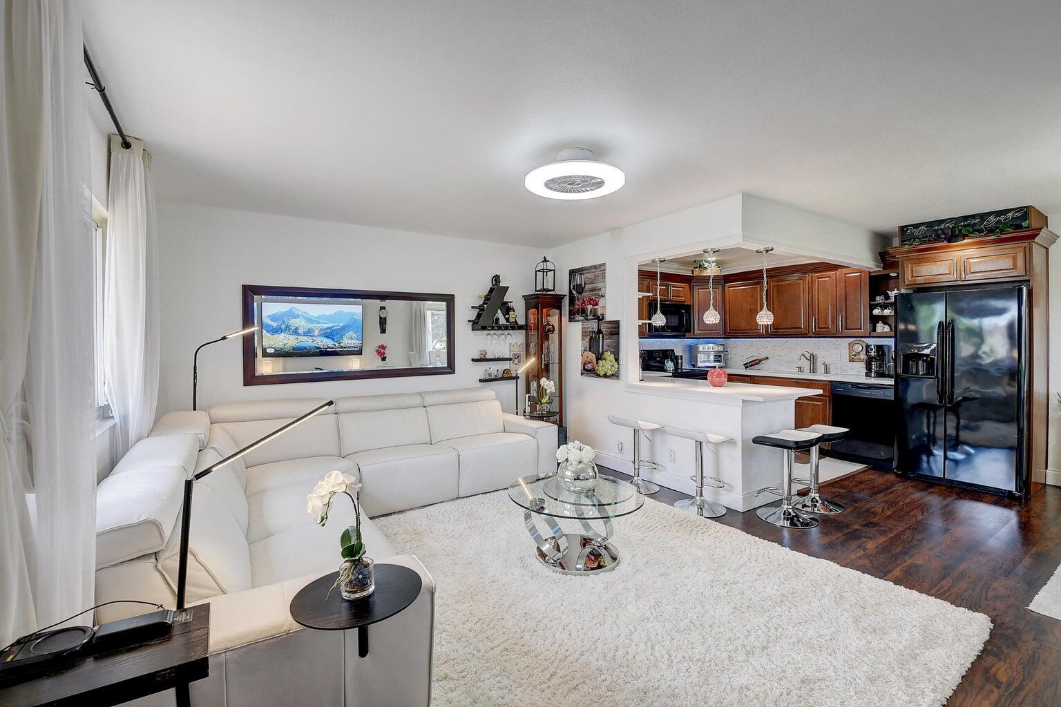 Turn Key 2nd floor corner unit, full impact windows throughout for sound proof and protection, fully furnished and equipped, modern style decor with pristine details including Washer & Dryer, fully equipped kitchen, small appliances, espresso maker, oven, pots, pans, dishes, linens, towels, extra office room space in enclosed balcony or lounge room. Modern fan/lighting fixtures in Livingroom and bedroom, central AC. Includes cable TV. Close to Jog Road residents gate.