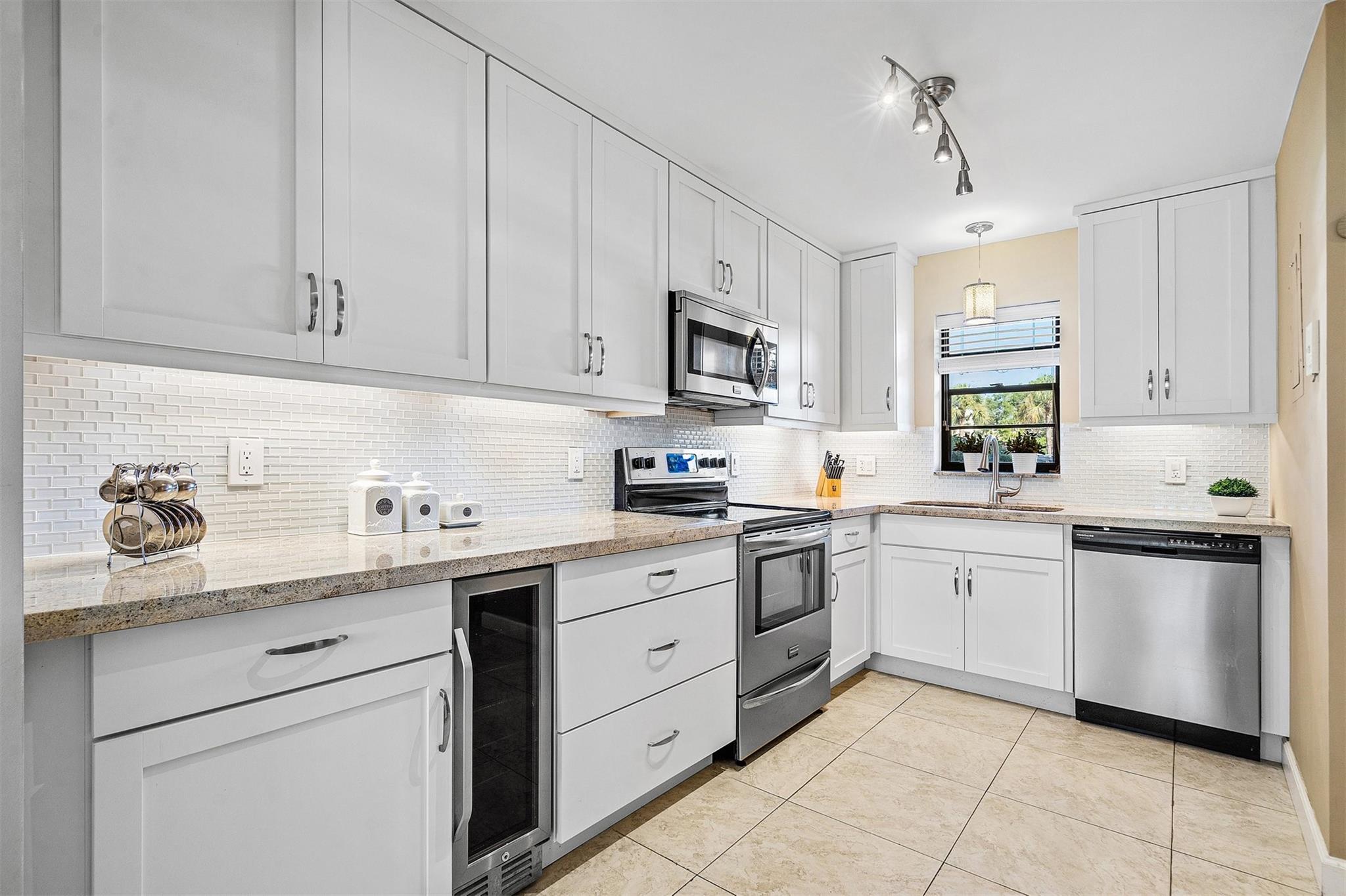 Beautifully updated 2BD/2BA condo at The Palms of Deer Creek in Deerfield Beach. This first-floor unit offers a bright open floor plan, white kitchen cabinets, and beautiful golf course views. Cozy and move-in ready, with furniture available for sale. Washer & dryer conveniently located on the same floor, plus a private storage unit. The community features a newly renovated gym, heated pool, and friendly neighbors. Located in the desirable Deer Creek area with its golf country club. Golf membership available but not required. A rare gem in a vibrant, active neighborhood!