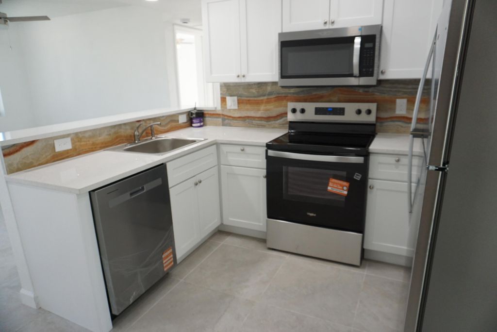 Photo of 957 Lewis Drive, Riviera Beach, FL 33403 (MLS # R11145747)