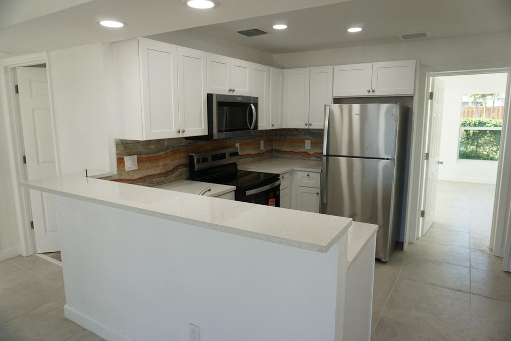 Photo of 957 Lewis Drive, Riviera Beach, FL 33403 (MLS # R11145747)