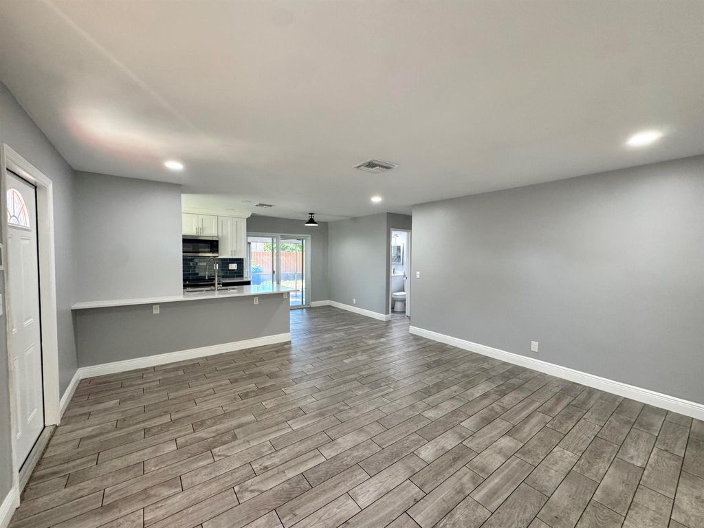 Photo of 919 Laurel Drive, Lake Park, FL 33403 (MLS # R11131849)