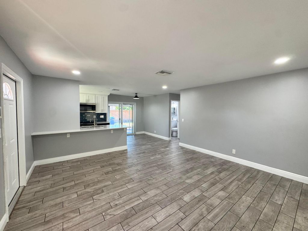 Photo of 919 Laurel Drive, Lake Park, FL 33403 (MLS # R11131849)