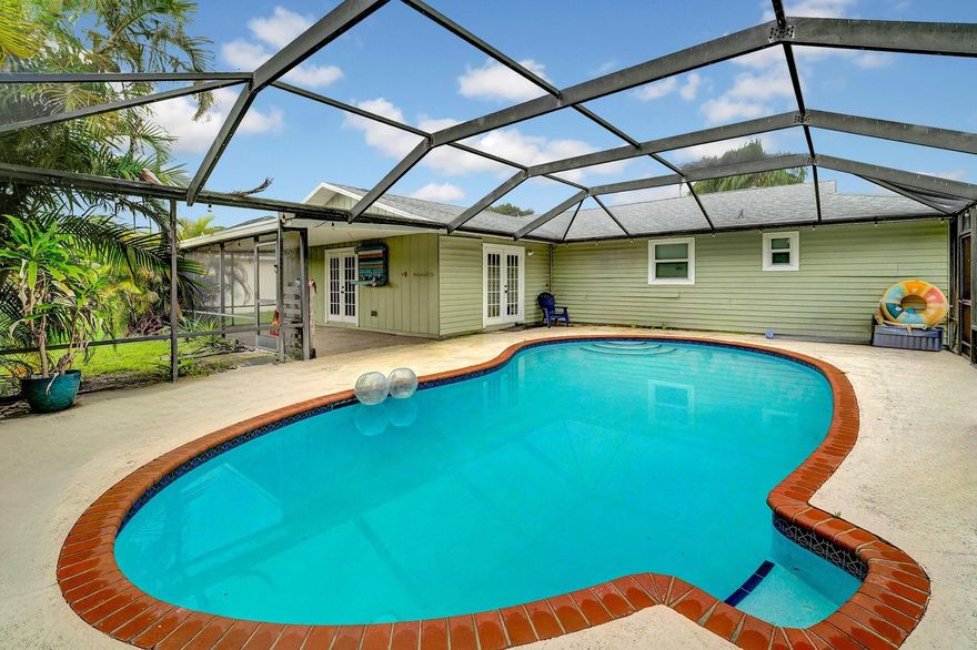 The search is over - come fall in LOVE with this 3 bedrooms, 2 bathrooms, flex room and HUGE Florida room with french doors leading to the covered screened in patio with a pool! Rent comfortably knowing you have a brand new roof, impact windows, open kitchen with granite counter tops, new pool pump, and updated bathrooms. Monthly rent includes pool and lawn maintenance.  The home is centrally located in Port St. Lucie close to the Florida Turnpike, beaches, Pioneer Park, beaches and so much more!