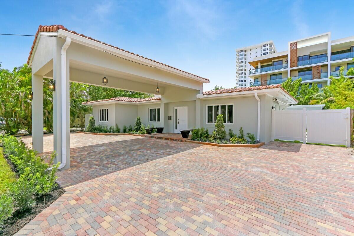 Welcome to 3025 Center Avenue, a beautifully renovated home just steps from Fort Lauderdale Beach. This home has a detached carport/suite. Completely updated from top to bottom, this stunning residence offers modern luxury, impeccable craftsmanship, and a prime location in one of South Florida's most desirable neighborhoods. Whether you're looking for a full-time residence, a vacation home, or a high-demand investment property, this home offers the perfect combination of style, comfort, and convenience.Designed for effortless living, this home features impact windows and doors, sleek tile flooring, and an open-concept layout that flows seamlessly throughout. The newly remodeled chef's kitchen boasts premium cabinetry, quartz countertops, a stylish backsplash, and high-end