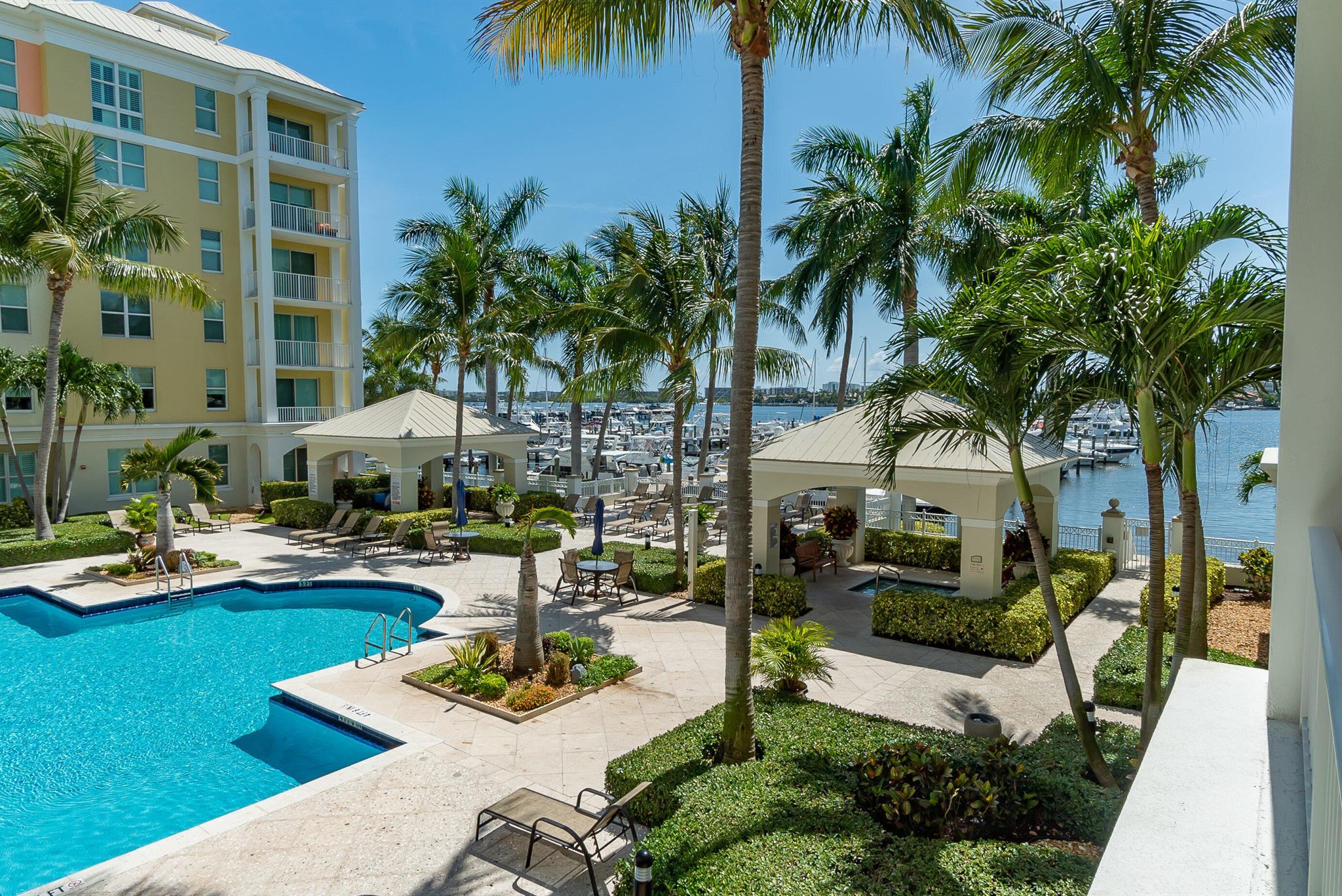 Tropical and tranquil Moorings 2/2 condo located on the 2nd floor with views to the resort style pool and marina on the intracoastal. Spacious split bedrooms both have en suite baths, allowing privacy. Multiple windows provide for a light-filled living area which leads out to a pleasant covered balcony with its pretty views. All windows are impact glass. Condo is being sold furnished. *Interior photos to be added this weekend.'' Situated on the Intracoastal, lushly landscaped Moorings has two pools and hot tubs, gym, club room, restaurant, cafe, 24 hour security, and valet.