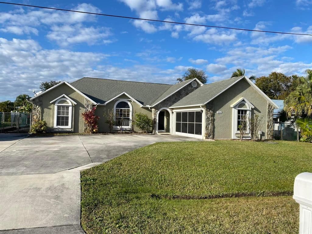 Photo of 2767 SE Rawlings Road, Port Saint Lucie, FL 34952 (MLS # R10771237)