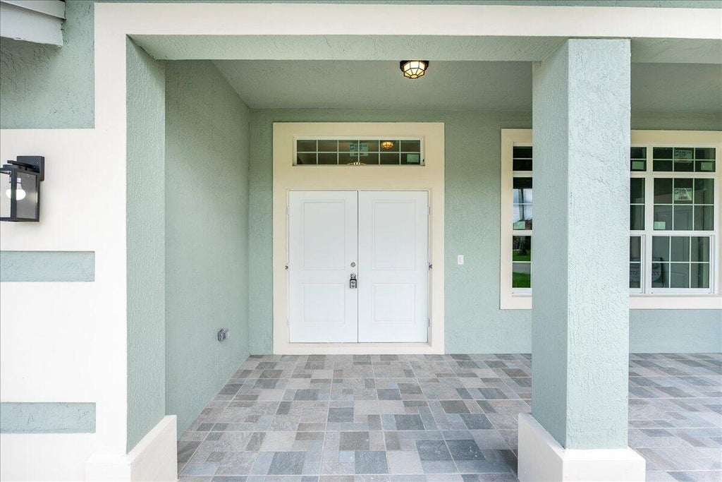 Photo of 1281 SW Ingrassina Avenue, Port Saint Lucie, FL 34953 (MLS # R10999091)