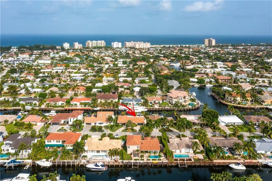 Venetian Isles Deepwater home sits on 90'+/- of waterfront on the Canale Della Corte waterway. From the moment you arrive, you are welcomed by the lush landscaping & beautiful curb appeal!  This single level residence was completely remodeled from the roof to the floors in 2014, along with many additional current updates.  Features of this open concept home include marble floors, impact windows/doors, 2 zone A/C plus A/C in garage & custom chef's kitchen.  Outdoor living gathers at the open air bar featuring built in grill, side burner, sink, refrigerator, TV and seating for 4! Expansive marble decking and pool area lead to dock with 90’ of composite decking, 14k lb. boat lift, jet ski lift, full water/power and minutes to the intracoastal, Hillsboro or Boca inlets! A must see home!