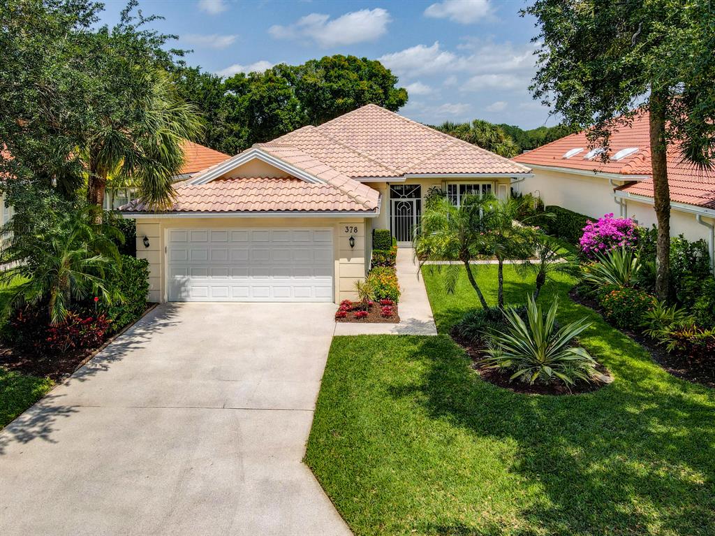 Peace and tranquility greet you at the door of this desirable Oaks East home. Natural light abounds in this 3 bedroom/ 2.5 bath Carmel model. Enjoy pristine views of the lake from the Great Room. The extended Kitchen has been completely upgraded and features granite countertops and custom 46'' cabinetry. The windows throughout the home feature brand new window tint to reduce electric bills and new Hunter Douglas custom window treatments inside. The home also features new electric wiring inside and out as well as new plumbing and a SMART lighting system. No expense was spared when professionally landscaping the front and back yards that both feature unique hard-wired lighting and paver walkways and patios. The home is complete with accordion hurricane shutters and new impact skylights