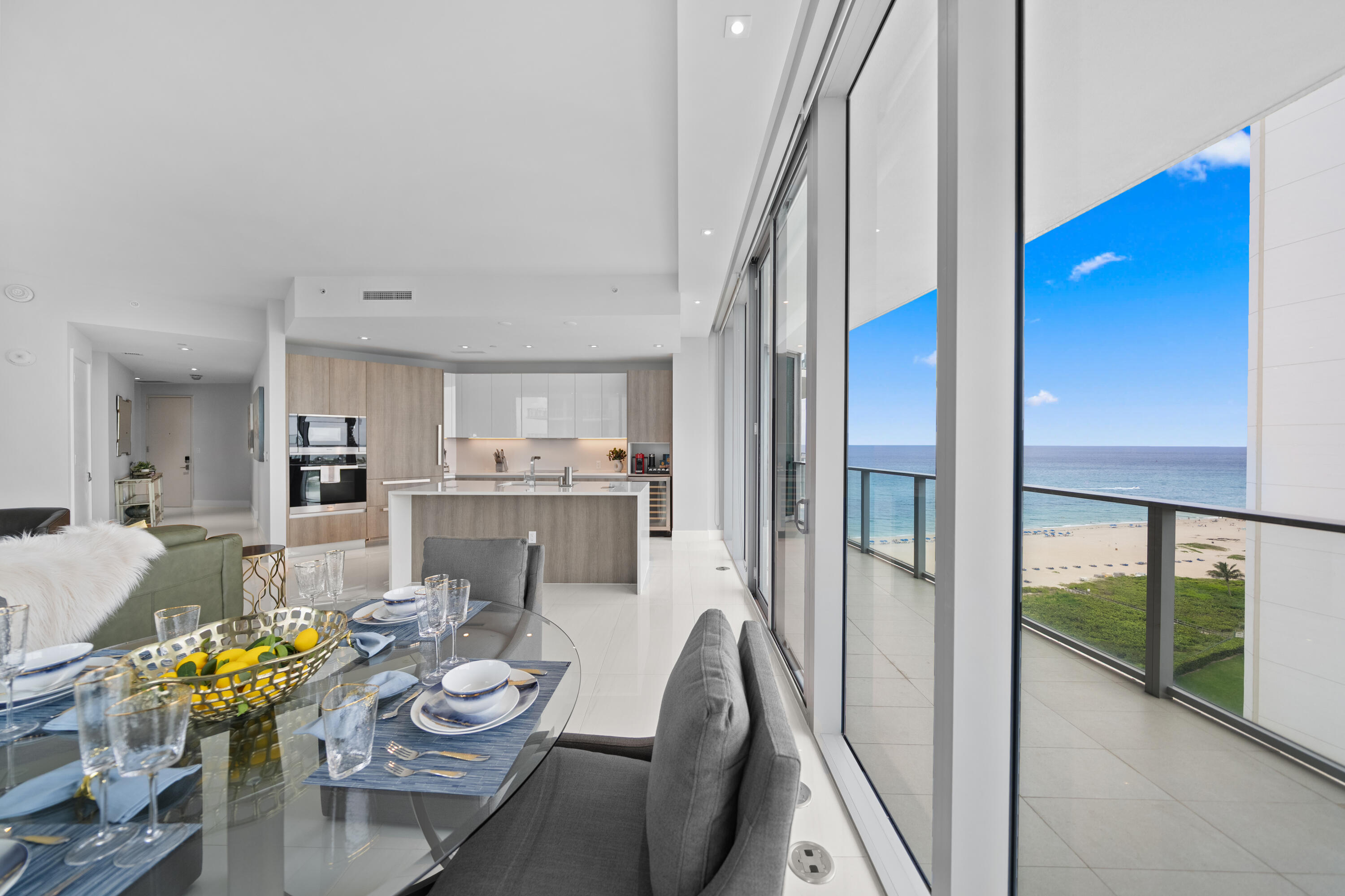 Welcome to your personal paradise at Amrit Ocean Resort and Residences in Singer Island, Florida. This stunning corner condo offers mesmerizing ocean and intracoastal views, complemented by a wraparound balcony where you can indulge in the beauty of passing boats and spectacular sunrises and sunsets. Step inside this sophisticated 2-bedroom, 3-bath haven, featuring expansive 10-foot floor-to-ceiling windows that bathe the space in natural light. The contemporary kitchen, equipped with top-tier Miele appliances, allows you to create culinary masterpieces while enjoying the vibrant waterfront activities. As a resident, revel in luxurious amenities including an ocean-view restaurant, spa, gym, and beauty salon, all while benefiting from valet parking and room service.