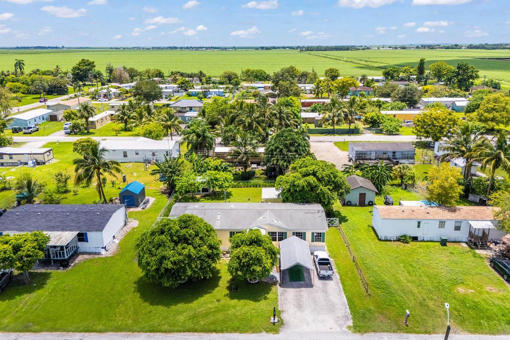 Photo of 1700 NE Avenue K Avenue, Belle Glade, FL 33430 (MLS # R11112666)