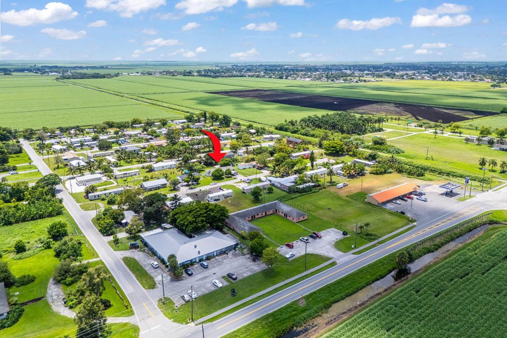 Photo of 1700 NE Avenue K Avenue, Belle Glade, FL 33430 (MLS # R11112666)