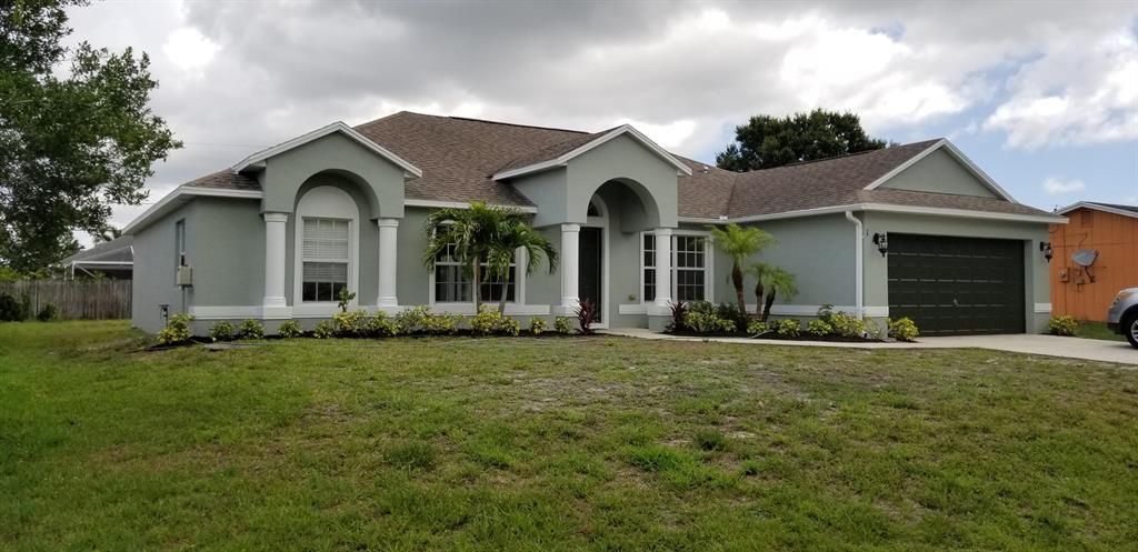 Photo of 1131 SW Colorado Avenue, Port Saint Lucie, FL 34953 (MLS # R10723144)