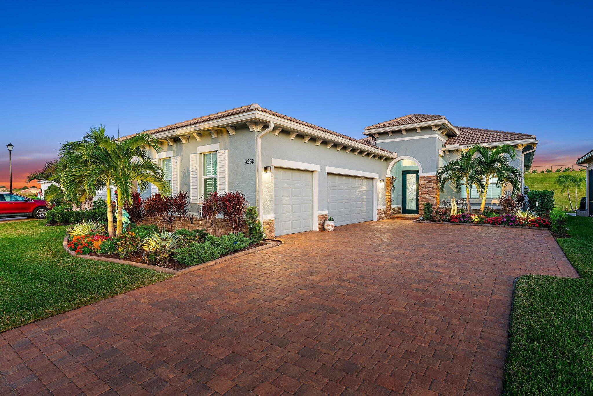 Welcome to 9259 SW Miracoli Way, an exquisite 3-bedroom, 2.5-bathroom CBS construction home with a stunning pool and hot tub, located in the prestigious Verano community of Port St Lucie, FL! This property combines luxury and comfort in one of Florida's most sought-after neighborhoods.As you enter this beautifully designed home, you are greeted by an open-concept layout that seamlessly blends spacious living and dining areas, perfect for entertaining family and friends. The well-appointed kitchen boasts modern appliances, waterfall quartz countertops, ample storage, and a breakfast nook overlooking the inviting outdoor space.Custom cabinetry and stone fireplace brings warmth and ambiance to the main living area. This home has more upgrades than you could ever imagine. Custom