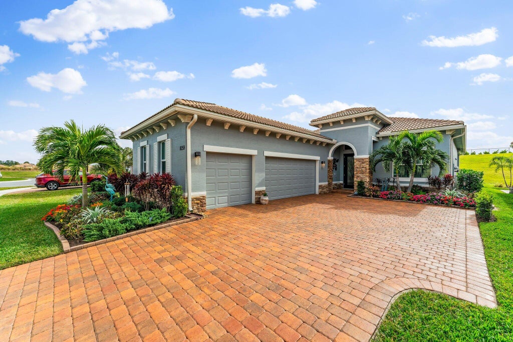 Photo of 9259 SW Miracoli Way, Port Saint Lucie, FL 34987 (MLS # R11048053)
