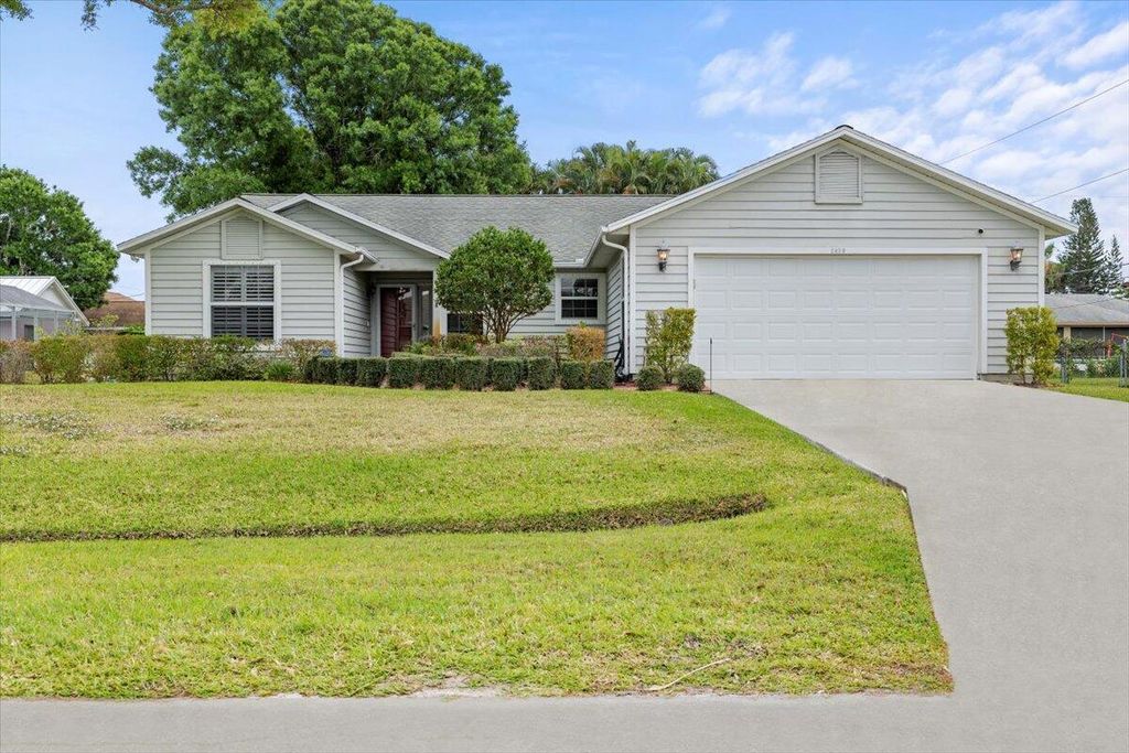Photo of 2409 SW Lafayette Street, Port St Lucie, FL 34953 (MLS # R10966354)