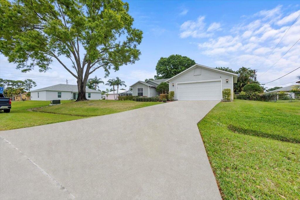 Photo of 2409 SW Lafayette Street, Port Saint Lucie, FL 34953 (MLS # R10966354)