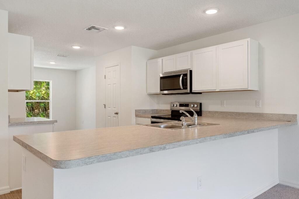 Photo of 2102 SE Holland St, Port Saint Lucie, FL 34952 (MLS # F10532431)