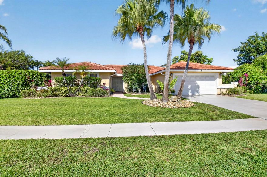 Located within the desirable Boca Greens community, this beautiful single-story home offers the perfect blend of elegance, comfort, and privacy. Featuring 4 spacious bedrooms and 2 full baths, the open-concept layout is ideal for both everyday living and entertaining. Step outside to your private oasis with an inviting pool, lush landscaping, and mature fruit trees (including Peach,Banana,Olive,and Pineapple Trees. Enjoy tranquil long lake views and exceptional privacy on this expansive 12,111 sq ft lot. This home offers side yard space with potential to expand or customize. Newer Roof 2020, Boca Greens features a beautifully maintained pay as you play 18-hole championship golf course with no mandatory membership required. A rare opportunity to experience the best of South Florida living!