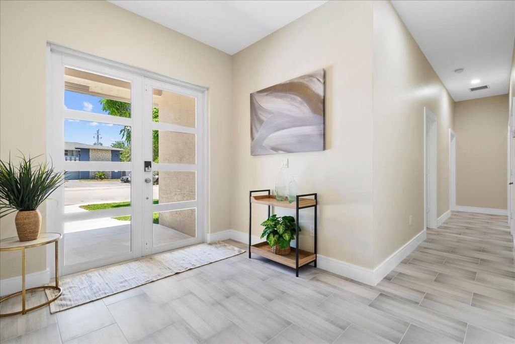 Photo of 818 Foresteria Drive, Lake Park, FL 33403 (MLS # R11043316)