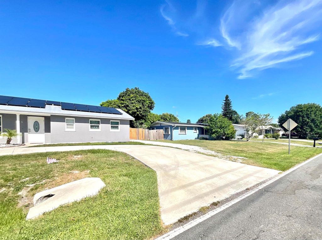 Photo of 409 NE Oleander Avenue, Port Saint Lucie, FL 34952 (MLS # R11100931)