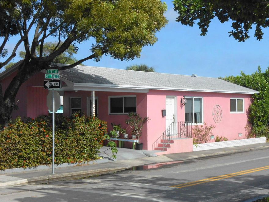 JUST LISTED IN LAKE WORTH BEACH!  MOVE-IN READY CONCRETE-BLOCK HOUSE favorably located just THREE BLOCKS FROM LAKE AVE.... Wow!  FHA, VA, and conventional-financing purchasers warmly welcomed.  Perfect for first-time home buyers.  Also great for investors.  No H.O.A., hooray!  Numerous highly-valuable components and upgrades: IMPACT WINDOWS AND DOORS, NEWER ROOF, central a/c, driveway, carport, landscaped fenced-in back yard, and so much more.  The stylish interior boasts gorgeous exposed-beam cathedral ceilings, distinctive oak hardwood floors, fully-redone kitchen, sleek quartz countertops.  Desirable, sunny, breezy, corner lot.  Mere minutes from the beach.  Don't miss out on the opportunity to own this wonderfully robust, fortified, durable, well-located residence!