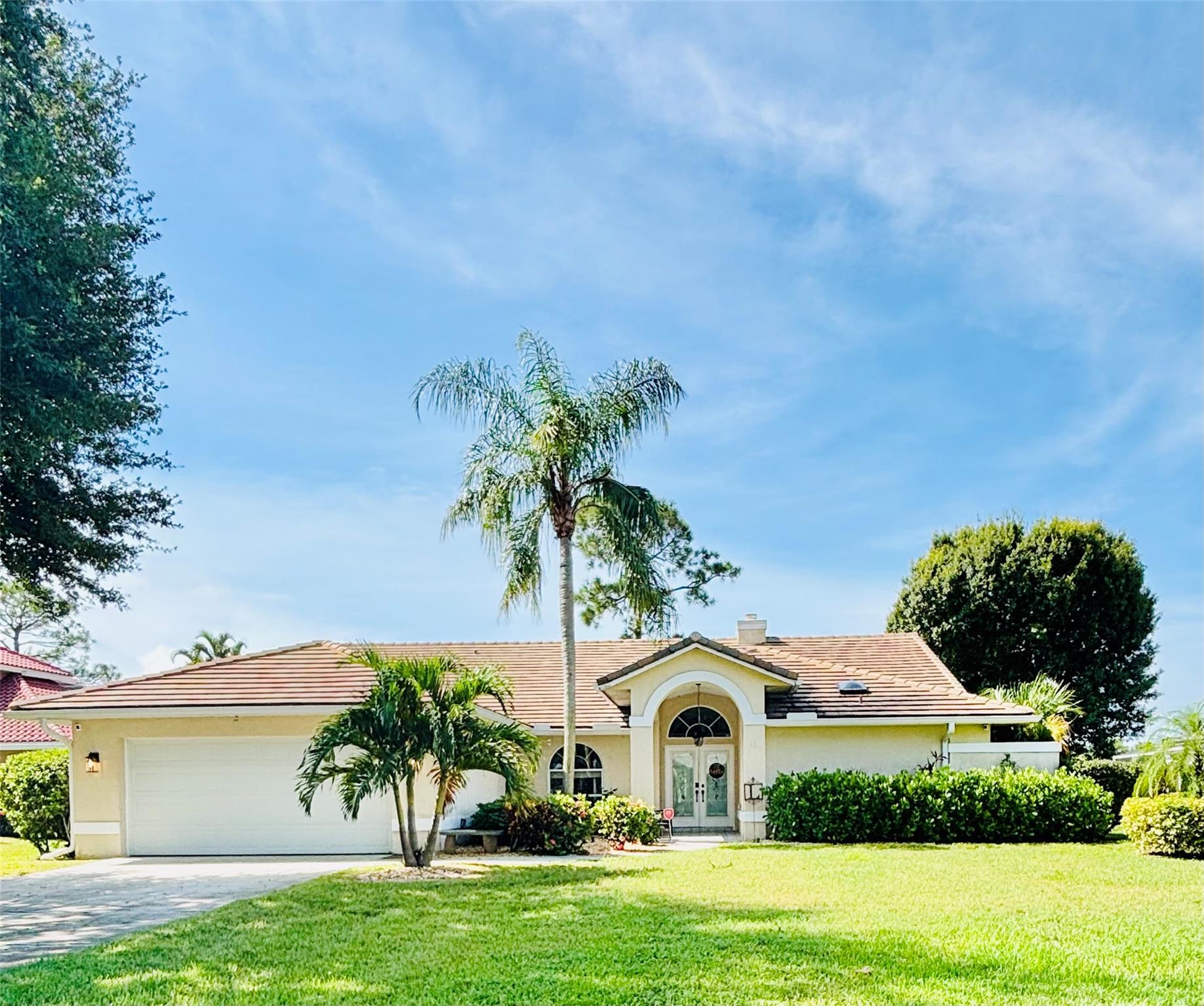 Welcome to this Florida gem in the heart of Country Club Estates. Perfectly positioned at the foot of a cul de sac, the home offers a blend of comfort and charm. Enjoy a generous living area featuring seperate breakfast and dining spaces. The bright kitchen boasts granite countertops and newer appliances. Retreat to the owner's suite complete with a skylit bathroom and an adjacent room ideal for a home office or gym. Bask in the tranquility of the large screened patio, ideal for entertaining or relaxing by the pool, while overlooking the manicured golf course. Enjoy peace of mind with a new roof (2023), newer AC (2021) and ductwork (2023). Close to thriving Tradition, NY Mets spring training facility (Clover Stadium), beaches, shopping and retail. A must see!