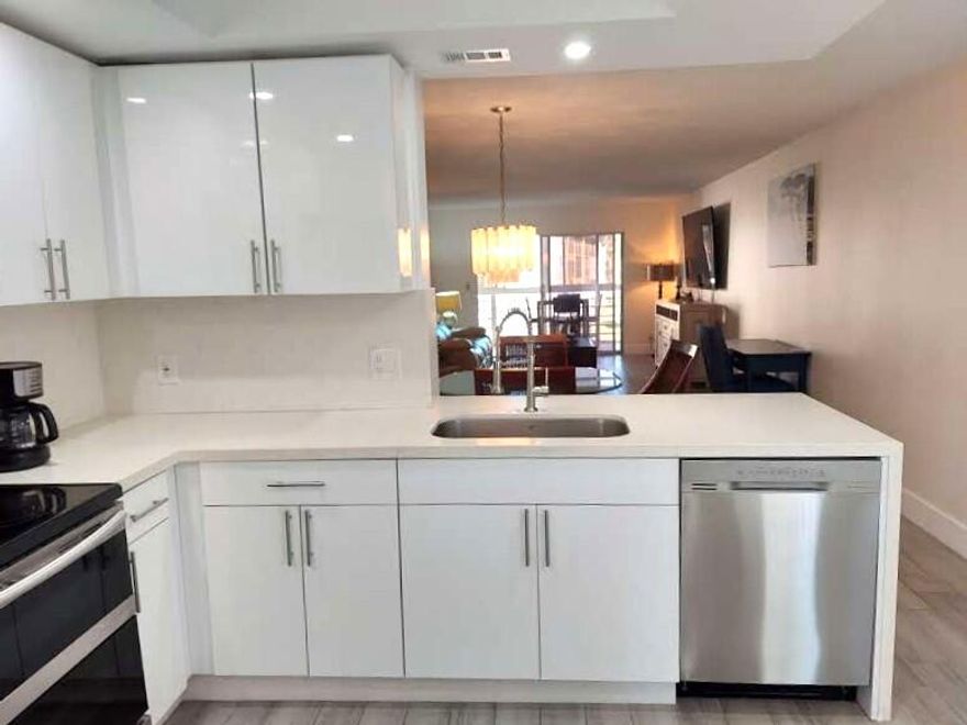 TURN-KEY 2/2 RENTAL. FULLY FURNISHED, JUST BRING YOUR PERSONAL BELONGINGS! OPEN KITCHEN W/WATERFALL QUARTZ, SHAKER CABINETS & UPDATED SS APPLIANCES. MODERN TILE FLOORING IN ALL LIVING AREAS, CARPET FOR YOUR COMFORT IN BEDROOMS. MASTER HAS SPACIOUS WALK- IN CLOSET. ENCLOSED PATIO HAS PICTURESQUE VIEWS OF WATER & GREENERY. LARGE FLAT SCREEN TV IN LIVINGROOM AND A 2ND FLATSCREEN IN THE MASTER BEDROOM.  ACTIVE CLUBHOUSE WITH A PLETHERA OF CLUBS & CLASSES! THERES A FULL GYM, BILLIARDS, PICKLEBALL, TENNIS, BOCCE BALL, DANCING, SHOWS, MOVIES, KAREOKE NIGHT AND SO MUCH MORE! HEATED POOLS AND BBQ'S CAN BE FOUND ALL THROUGHOUT THE COMMUNITY. FREE SHUTTLE BUSES! WYNMOOR IS LOCATED NEAR GREAT SHOPPING EATERIES & ALL MAJOR HIGHWAYS.  COME AND ENJOY THE MAGIC OF WYNMOOR!